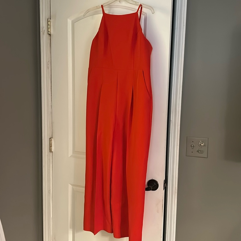 New without tags! Red tie back jumpsuit with pockets